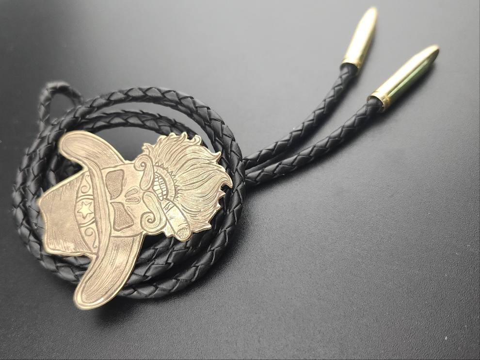 The Outlaw Bolo Tie – Hand-Engraved Brass with Bullet Tips