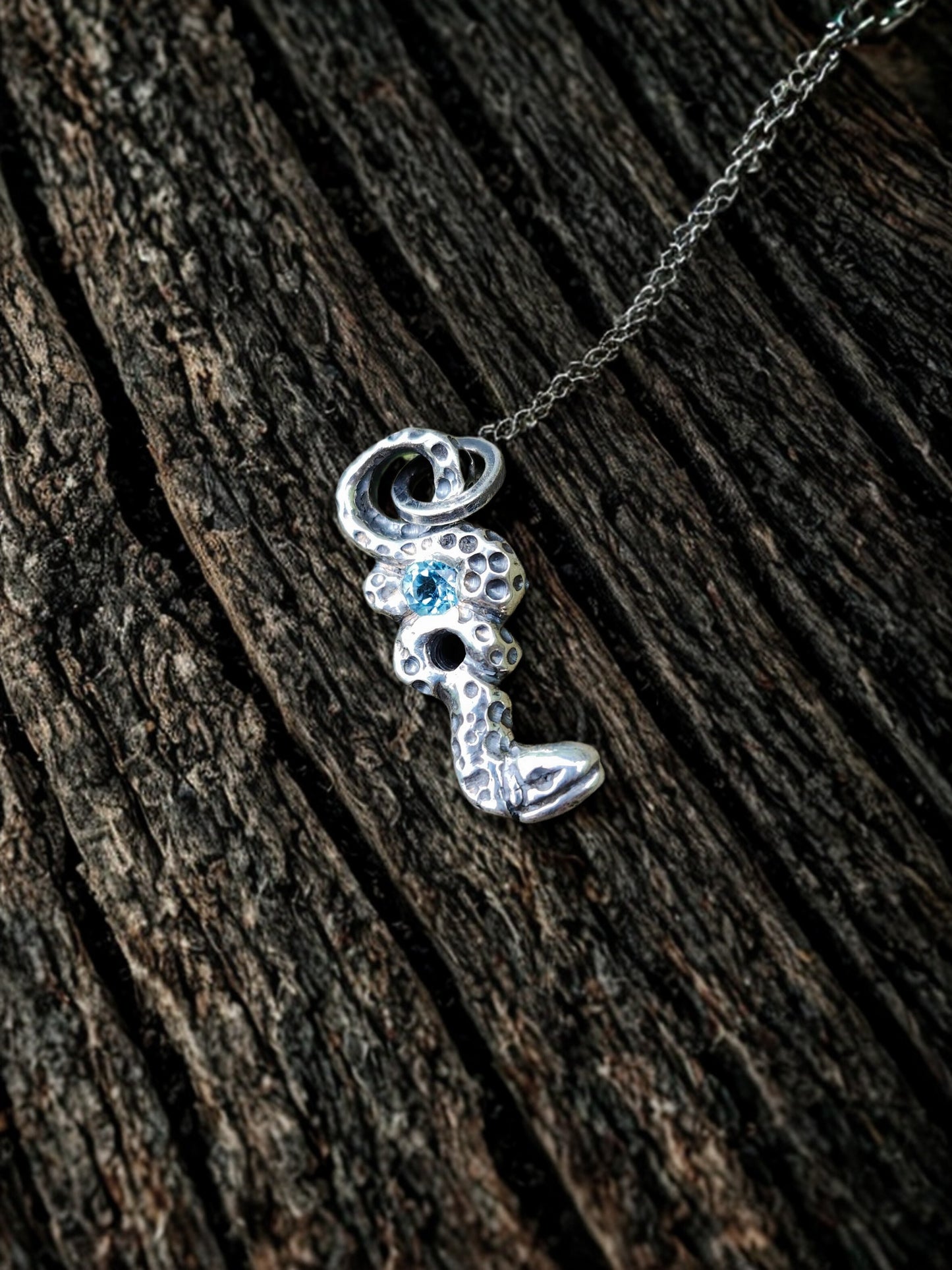 Blue Topaz Serpent Pendant – Hand-Carved Sterling Silver Jewelry