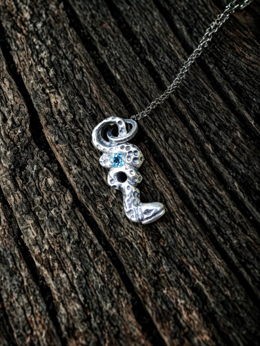 Blue Topaz Serpent Pendant β Hand-Carved Sterling Silver Jewelry