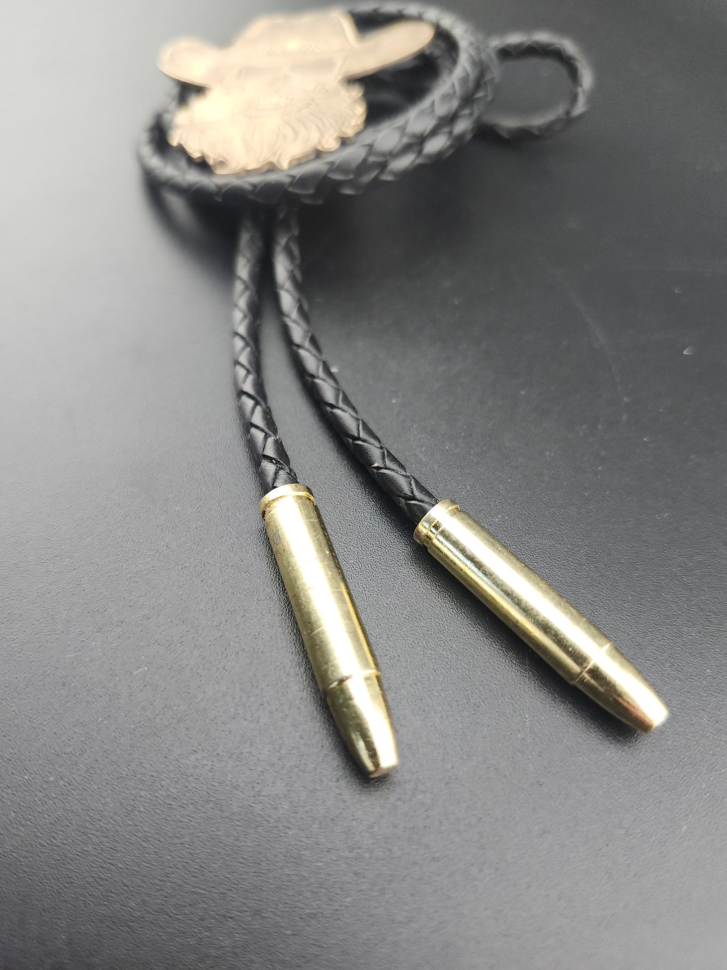 The Outlaw Bolo Tie – Hand-Engraved Brass with Bullet Tips